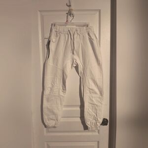 White modern pants. Zipper on one side. Size medium also fits as a small.